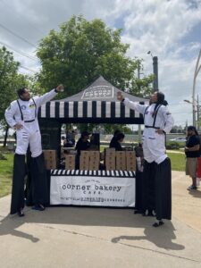 Image of Corner Bakery tent and team members